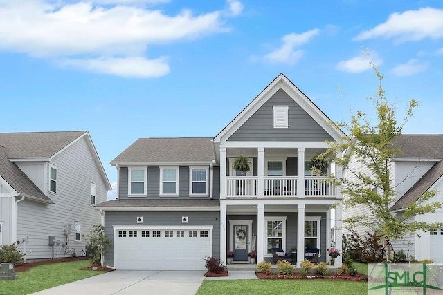 710 Longleaf Dr, Richmond Hill, GA 31324 - neoclassical / greek revival house featuring a porch, a balcony, concrete driveway, an attached garage, and a front lawn