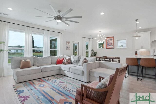 710 Longleaf Dr, Richmond Hill, GA 31324 - living area with light wood-style flooring, ceiling fan, recessed lighting, and a chandelier
