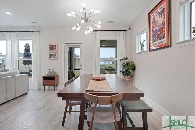 710 Longleaf Dr, Richmond Hill, GA 31324 - dining room with a chandelier, healthy amount of natural light, light wood-style flooring, and recessed lighting
