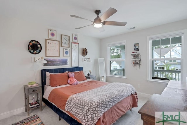 710 Longleaf Dr, Richmond Hill, GA 31324 - bedroom with carpet flooring, baseboards, and a ceiling fan