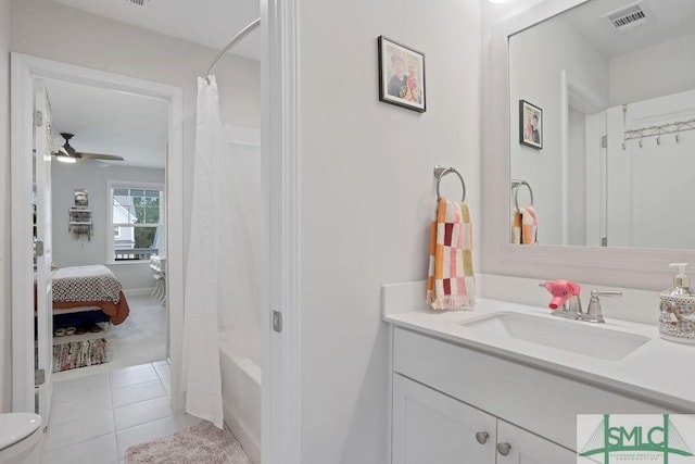 710 Longleaf Dr, Richmond Hill, GA 31324 - ensuite bathroom with vanity, ceiling fan, tile patterned flooring, toilet, and shower / bath combination with curtain