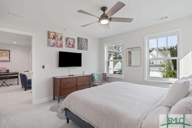 710 Longleaf Dr, Richmond Hill, GA 31324 - bedroom featuring light carpet, baseboards, and a ceiling fan