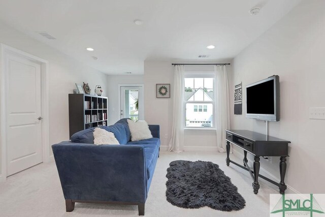 710 Longleaf Dr, Richmond Hill, GA 31324 - living room featuring light carpet, baseboards, and recessed lighting