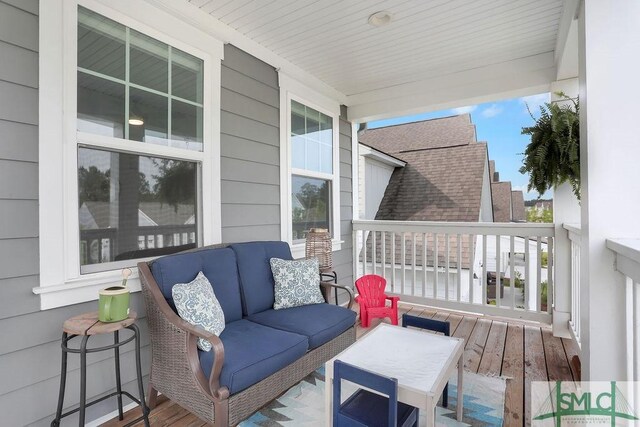 710 Longleaf Dr, Richmond Hill, GA 31324 - deck featuring covered porch and an outdoor living space
