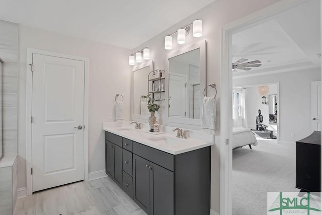 710 Longleaf Dr, Richmond Hill, GA 31324 - full bathroom with double vanity, connected bathroom, and baseboards