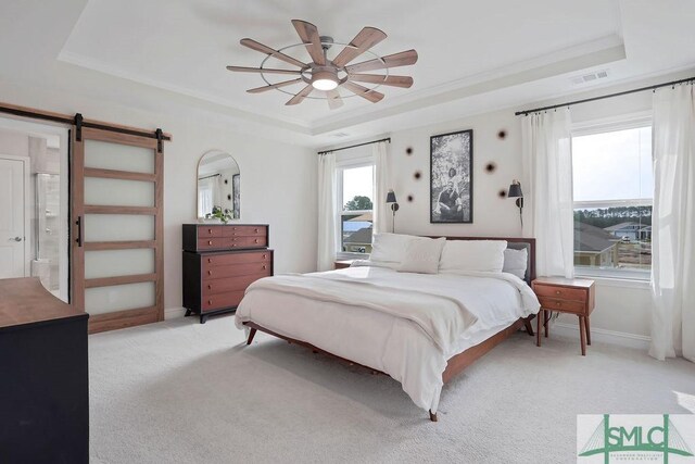 710 Longleaf Dr, Richmond Hill, GA 31324 - bedroom with a raised ceiling, light colored carpet, a barn door, baseboards, and crown molding