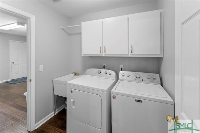 6 Baysprings Pt, Savannah, GA 31405 - washroom with cabinet space, washing machine and clothes dryer, dark wood finished floors, and baseboards
