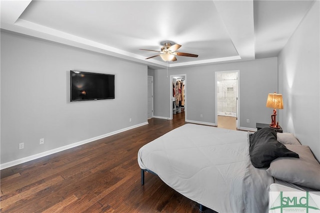 6 Baysprings Pt, Savannah, GA 31405 - bedroom with a tray ceiling, baseboards, a walk in closet, and wood finished floors