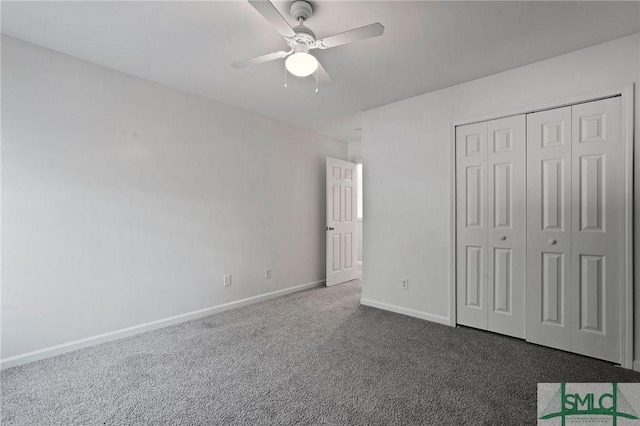 unfurnished bedroom with carpet floors, baseboards, a closet, and ceiling fan