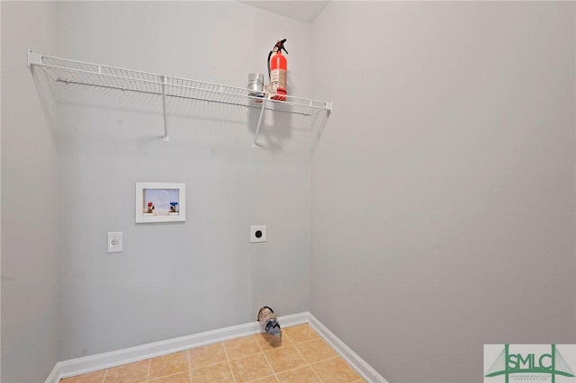 clothes washing area featuring electric dryer hookup, washer hookup, and baseboards