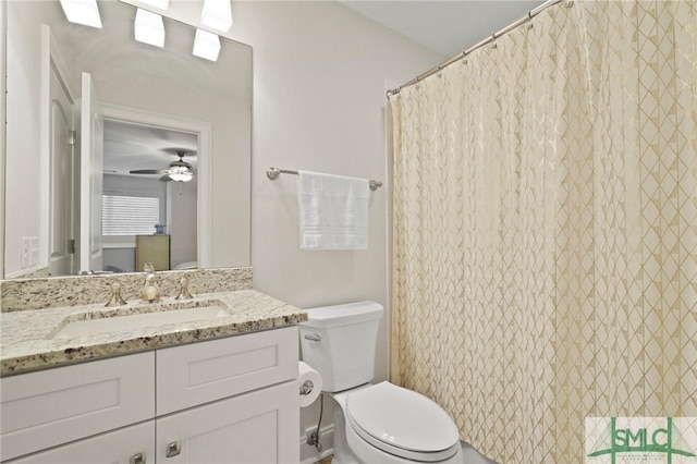 bathroom featuring toilet and vanity