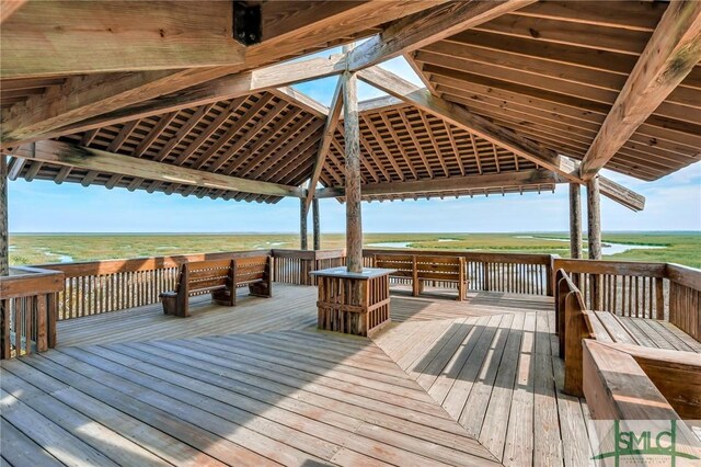 wooden deck featuring a water view