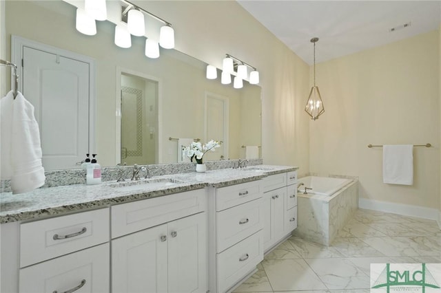full bath with marble look tile flooring, a shower stall, a garden tub, double vanity, and baseboards