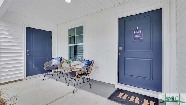 view of exterior entry with a porch