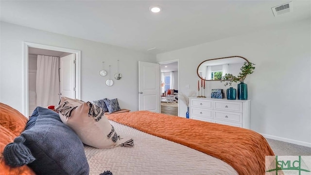 carpeted bedroom with baseboards and recessed lighting
