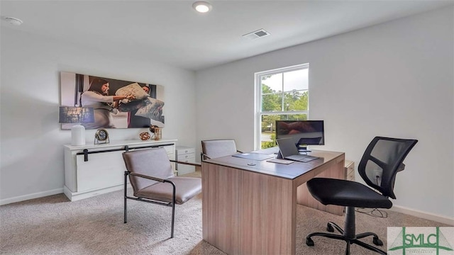 carpeted office with baseboards
