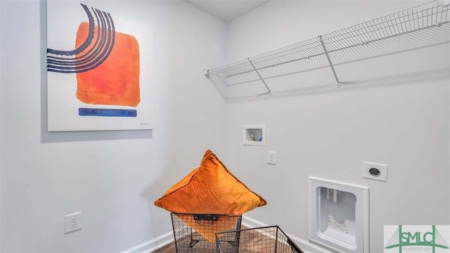 clothes washing area featuring washer hookup, hookup for an electric dryer, and baseboards