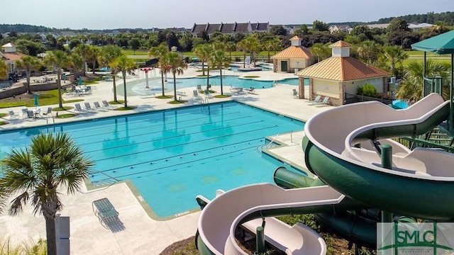 community pool with a patio area