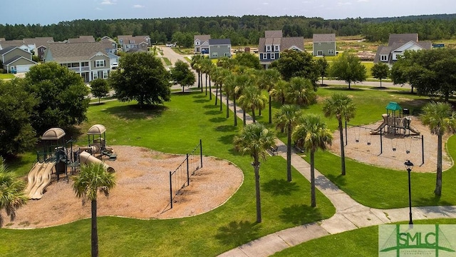 view of community featuring a yard and a residential view