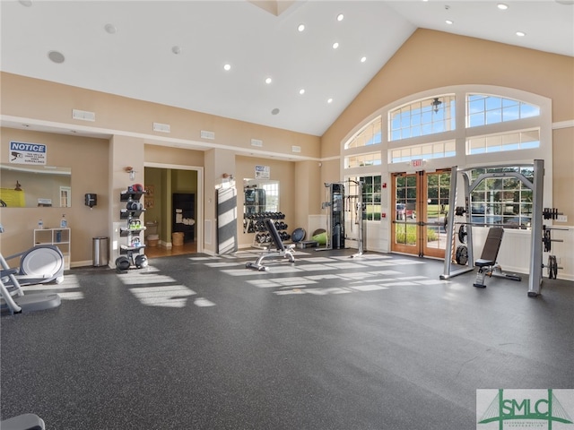 exercise room with recessed lighting, high vaulted ceiling, and french doors