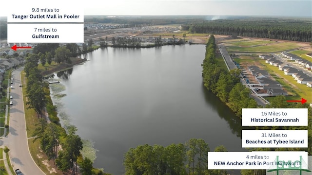 aerial view of property and surrounding area featuring a large body of water