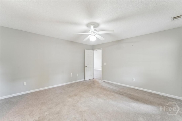 105 Mustang Dr, Guyton, GA 31312 - spare room featuring a ceiling fan, light colored carpet, baseboards, and a textured ceiling