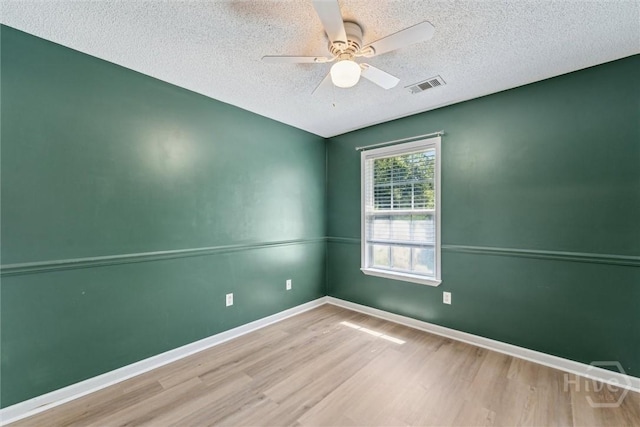 105 Mustang Dr, Guyton, GA 31312 - empty room featuring wood finished floors, a textured ceiling, ceiling fan, and baseboards