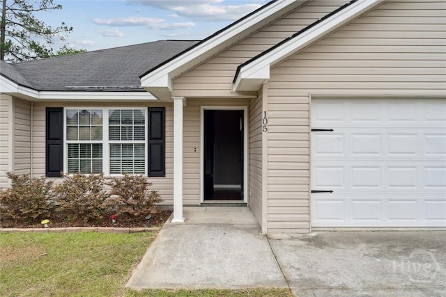 105 Mustang Dr, Guyton, GA 31312 - property entrance with a garage and a shingled roof