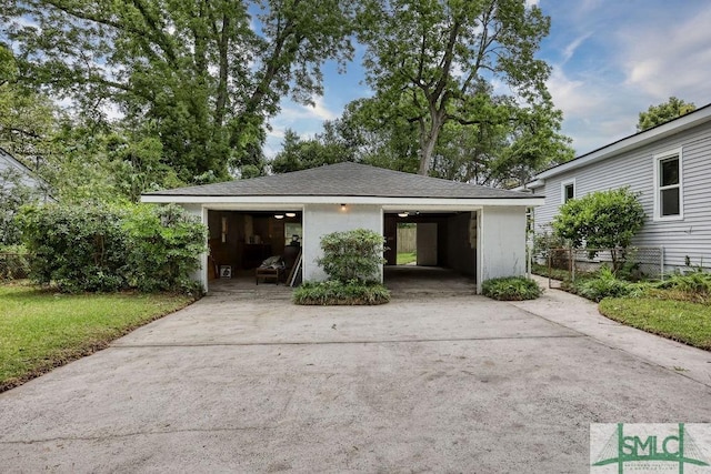 40 Lawton Ave, Savannah, GA 31404 - view of front of home featuring a garage, fence, and an outdoor structure