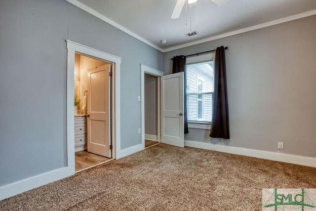 40 Lawton Ave, Savannah, GA 31404 - unfurnished bedroom featuring carpet flooring, crown molding, baseboards, connected bathroom, and a ceiling fan