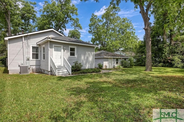 40 Lawton Ave, Savannah, GA 31404 - back of house featuring a yard and central AC unit