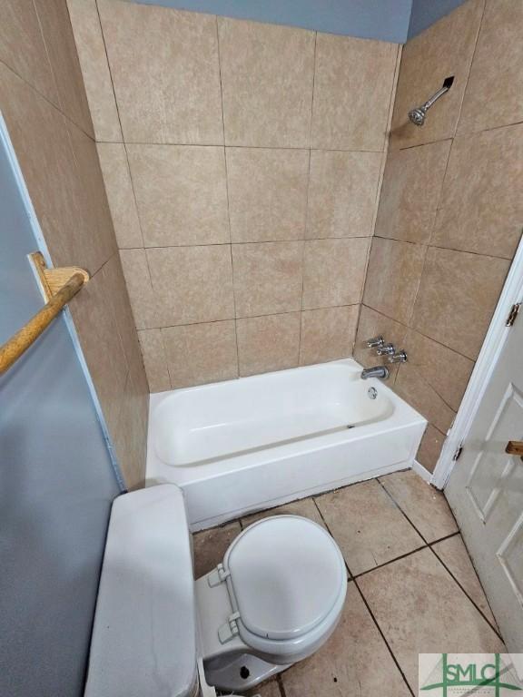 bathroom featuring tile patterned floors and bathtub / shower combination