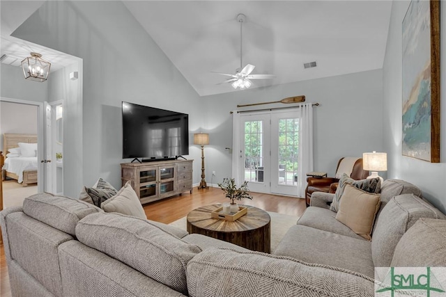 144 Royal Ln, Pooler, GA 31322 - living area featuring wood finished floors, a ceiling fan, a chandelier, and high vaulted ceiling