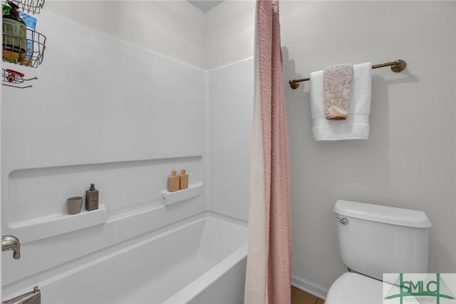 144 Royal Ln, Pooler, GA 31322 - bathroom featuring toilet, baseboards, and shower / bath combo