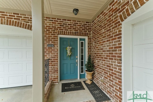 1104 River Oaks Dr Unit 1104, Richmond Hill, GA 31324 - property entrance with brick siding, a garage, and a porch