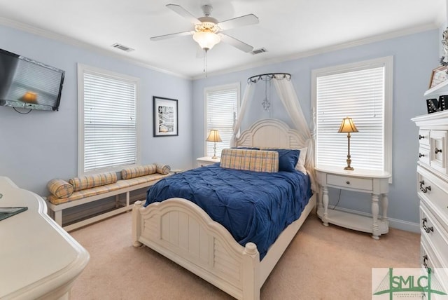 bedroom with light carpet, crown molding, and a ceiling fan