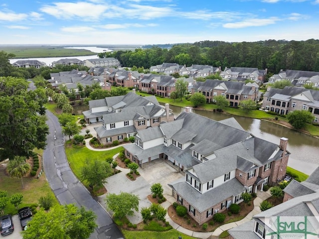 aerial view of residential area with a nearby body of water