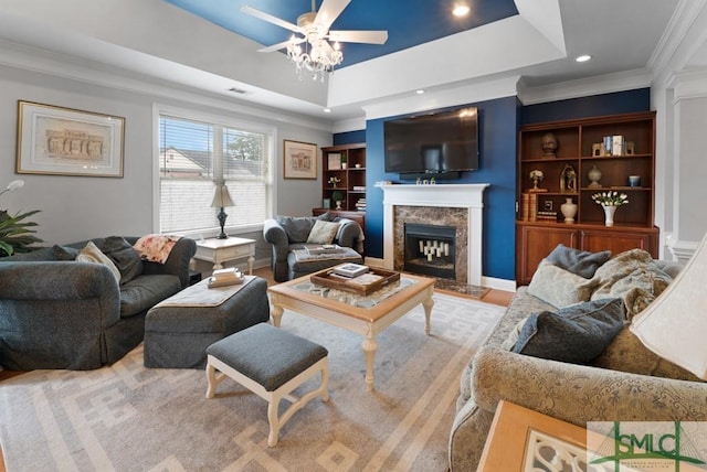 1104 River Oaks Dr Unit 1104, Richmond Hill, GA 31324 - living area with a ceiling fan, a raised ceiling, a high end fireplace, ornamental molding, and recessed lighting