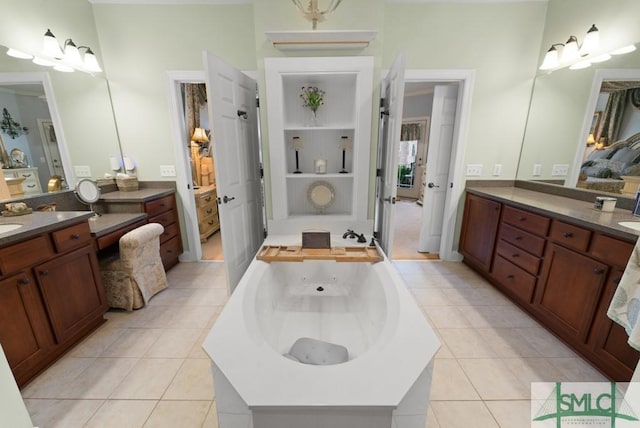 1104 River Oaks Dr Unit 1104, Richmond Hill, GA 31324 - full bath with connected bathroom, a whirlpool tub, tile patterned floors, and vanity