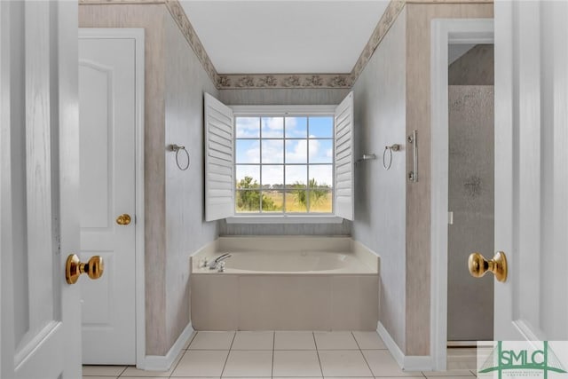 105 Crooked Wood Ln, Savannah, GA 31406 - bathroom featuring a garden tub, baseboards, wallpapered walls, and tile patterned floors