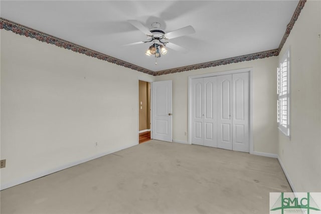 105 Crooked Wood Ln, Savannah, GA 31406 - unfurnished bedroom featuring a closet, multiple windows, and baseboards