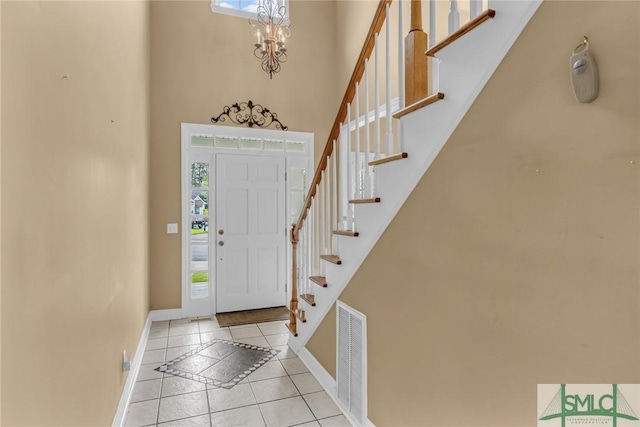 105 Crooked Wood Ln, Savannah, GA 31406 - foyer with plenty of natural light, a high ceiling, baseboards, inlaid floor details, and stairs