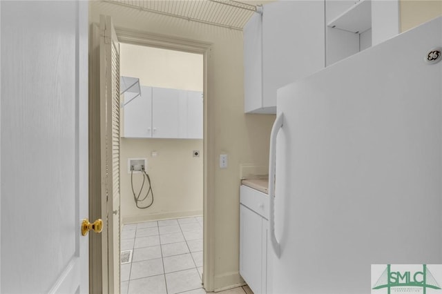 105 Crooked Wood Ln, Savannah, GA 31406 - washroom featuring washer hookup, cabinet space, electric dryer hookup, light tile patterned flooring, and baseboards