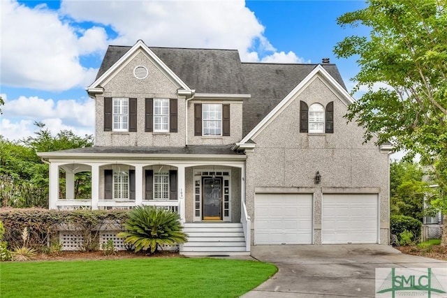 105 Crooked Wood Ln, Savannah, GA 31406 - view of front of home featuring a porch, concrete driveway, a chimney, a garage, and a front lawn