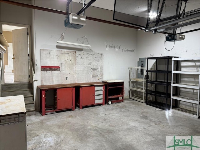 105 Crooked Wood Ln, Savannah, GA 31406 - garage with a garage door opener and a workshop area