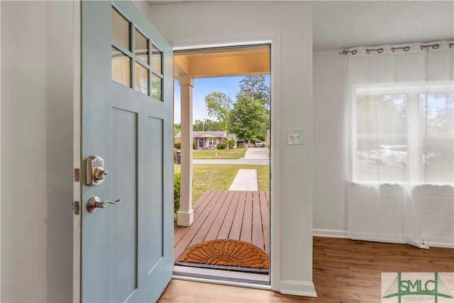 108 Gilliam Ave, Savannah, GA 31406 - doorway to outside featuring wood finished floors and baseboards