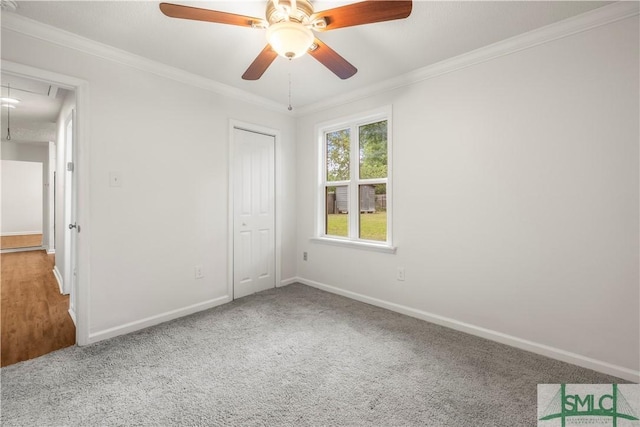 108 Gilliam Ave, Savannah, GA 31406 - unfurnished bedroom with attic access, carpet floors, baseboards, ornamental molding, and a closet