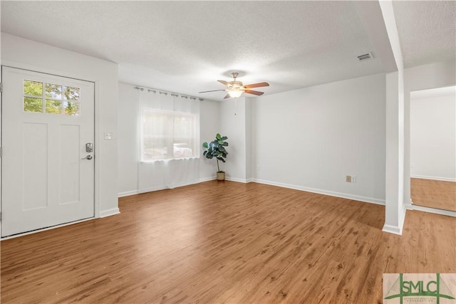 108 Gilliam Ave, Savannah, GA 31406 - foyer entrance featuring light wood-type flooring, ceiling fan, baseboards, and a textured ceiling