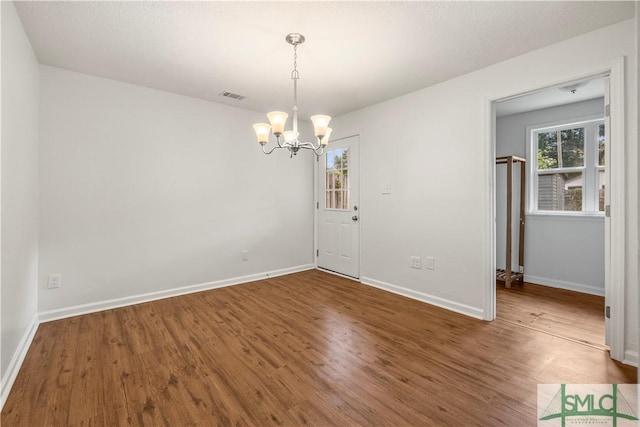 108 Gilliam Ave, Savannah, GA 31406 - unfurnished dining area featuring a chandelier, wood finished floors, and baseboards