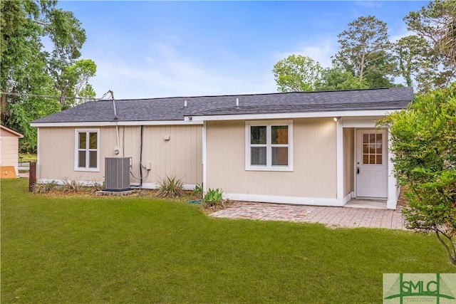 108 Gilliam Ave, Savannah, GA 31406 - back of house featuring cooling unit, a lawn, and a shingled roof